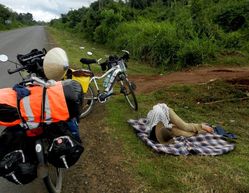 Lying on the roadside, sleeping from exhaustion